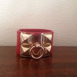 Red cuff bracelet with golden hardware